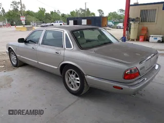 1999 Jaguar XJ with VIN SAJHX1043XC856474, listed as a IAAI auction lot 41626649 with 103,266 mi miles and . Bid and sale history available at DreamBid. Image 3.