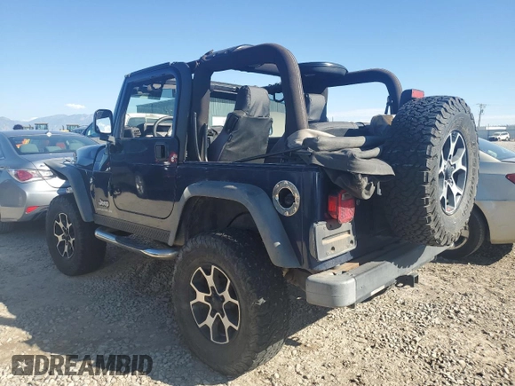 2005 Jeep Wrangler SE with VIN 1J4FA29S65P330905, listed as a Copart auction lot 71633134 with 77,598 mi miles and Salvage Title. Bid and sale history available at carsss.com. Image 2.