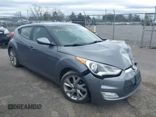 2017 Hyundai Veloster with VIN KMHTC6ADXHU306146, listed as a IAAI auction lot 41715687 with 113,364 mi miles. Bid and sale history available at carsss.com. Image 1.