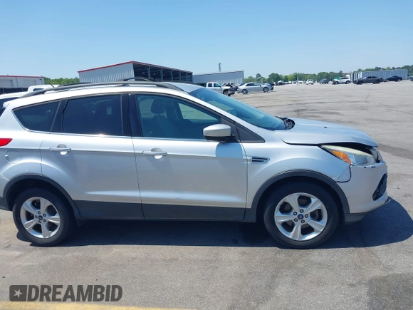 2013 Ford Escape SE with VIN 1FMCU0GX0DUA19811, listed as a IAAI auction lot 42009015 with 135,662 mi miles. Bid and sale history available at carsss.com. Image 13.
