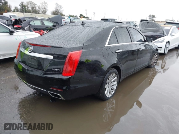 2014 Cadillac CTS Luxury AWD with VIN 1G6AX5SX3E0156938, listed as a IAAI auction lot 41574318 with 151,585 mi miles and . Bid and sale history available at DreamBid. Image 4.