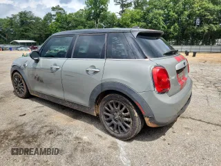 2015 MINI Hardtop 4 Door with VIN WMWXS5C5XFT831555, listed as a Copart auction lot 61673485 with 104,120 mi miles and Salvage title. Bid and sale history available at DreamBid. Image 2.