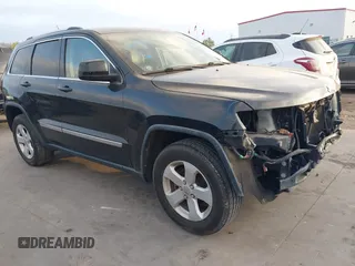 2013 Jeep Grand Cherokee Laredo with VIN 1C4RJEAG5DC571629, listed as a IAAI auction lot 41783334 with 131,098 mi miles. Bid and sale history available at carsss.com. Image 1.