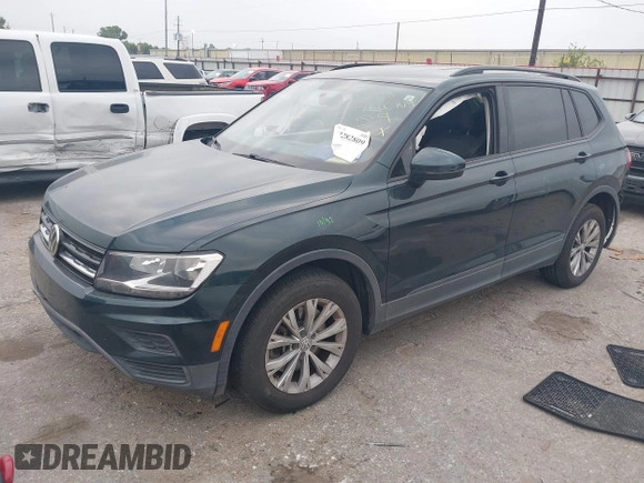 2019 Volkswagen Tiguan S with VIN 3VV1B7AXXKM002312, listed as a IAAI auction lot 42282809 with 80,781 mi miles and . Bid and sale history available at DreamBid. Image 2.