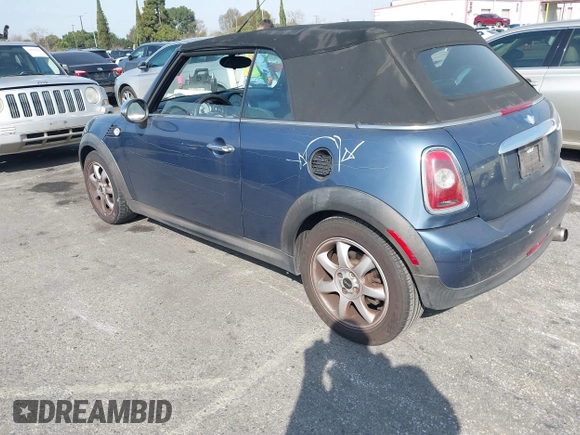 2010 MINI Convertible with VIN WMWMR3C53ATU97865, listed as a IAAI auction lot 41610670 with 154,457 mi miles and . Bid and sale history available at DreamBid. Image 3.