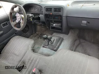 1995 Nissan Frontier XE with VIN 1N6SD11Y2SC308065, listed as a Copart auction lot 45282595 with 51,994 mi miles and Salvage title. Bid and sale history available at DreamBid. Image 8.
