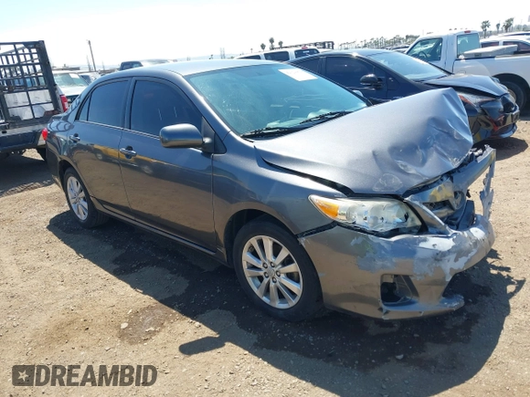 2011 Toyota Corolla L with VIN 2T1BU4EE7BC738640, listed as a IAAI auction lot 42024474 with 164,322 mi miles. Bid and sale history available at carsss.com. Image 1.