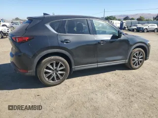 2018 Mazda CX-5 Grand Touring с VIN JM3KFADM2J1310339, выставлен на аукционе Copart как лот 64705245 с пробегом 63 927 миль миль и Списание • Salvage title. История ставок и продаж доступна на DreamBid. Изображение 3.
