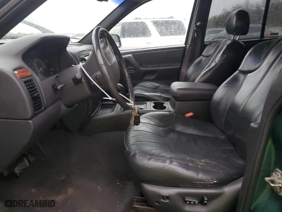 1999 Jeep Grand Cherokee Laredo with VIN 1J4GW58N0XC684111, listed as a Copart auction lot 85944784 with 128,741 mi miles and Salvage Title. Bid and sale history available at carsss.com. Image 7.