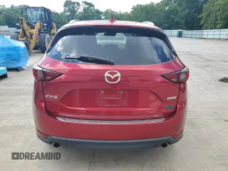 2019 Mazda CX-5 Grand Touring with VIN JM3KFADM2K1657915, listed as a Copart auction lot 56647145 with 85,095 mi miles and Salvage title. Bid and sale history available at DreamBid. Image 6.