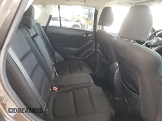 2016 Mazda CX-5 Touring z VIN JM3KE2CY4G0805072, wystawiony jako Copart lot #58435535 z przebiegiem 146 323 mil mil oraz Szkoda całkowita • Salvage title. Historia ofert i sprzedaży dostępna na DreamBid. Obrazek 10.
