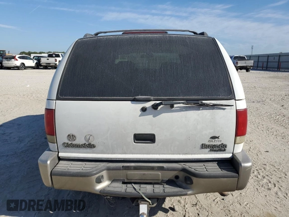 2000 Oldsmobile Bravada z VIN 1GHDT13W8Y2333619, wystawiony jako Copart lot #49631575 z przebiegiem 256 252 mil mil oraz Szkoda całkowita • Salvage title. Historia ofert i sprzedaży dostępna na DreamBid. Obrazek 6.