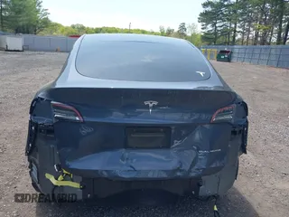 2020 Tesla Model Y Long Range with VIN 5YJYGDEE2LF029385, listed as a IAAI auction lot 42164786 with 58,685 mi miles and . Bid and sale history available at DreamBid. Image 16.