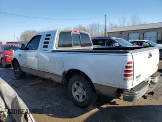 2002 Ford F-150 XL with VIN 1FTRX17L52NA26169, listed as a Copart auction lot 88756715 with 114,841 mi miles and Salvage title. Bid and sale history available at DreamBid. Image 2.
