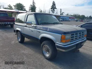 1989 Ford Bronco z VIN 1FMCU14T7KUB49671, wystawiony jako IAAI lot #42404266 z przebiegiem 22 883 mil mil oraz . Historia ofert i sprzedaży dostępna na DreamBid. Obrazek 1.