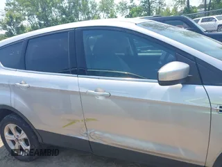 2014 Ford Escape SE with VIN 1FMCU9GX3EUC42964, listed as a IAAI auction lot 42484080 with 124,696 mi miles and . Bid and sale history available at DreamBid. Image 13.