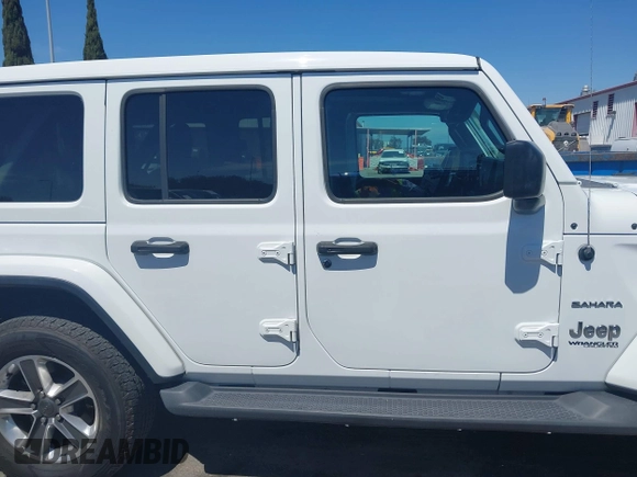 2019 Jeep Wrangler Unlimited Sahara with VIN 1C4HJXENXKW684942, listed as a IAAI auction lot 42021869 with 55,137 mi miles and . Bid and sale history available at DreamBid. Image 13.