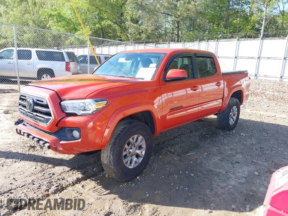 2018 Toyota Tacoma SR5 with VIN 5TFAZ5CN2JX069067, listed as a IAAI auction lot 41975459 with 92,434 mi miles and . Bid and sale history available at DreamBid. Image 2.