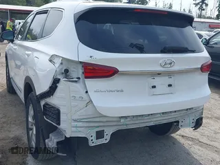 2020 Hyundai Santa Fe SE with VIN 5NMS23AD1LH192085, listed as a IAAI auction lot 42455451 with 50,517 mi miles and . Bid and sale history available at DreamBid. Image 6.