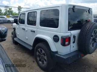 2018 Jeep Wrangler Unlimited Sahara with VIN 1C4HJXEG1JW205789, listed as a IAAI auction lot 42435877 with 57,587 mi miles and . Bid and sale history available at DreamBid. Image 3.