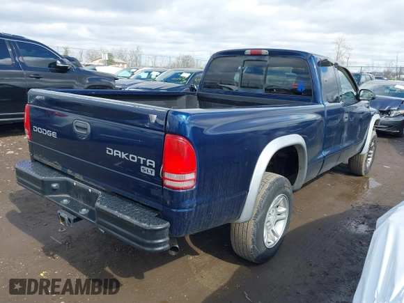2004 Dodge Dakota SLT with VIN 1D7HG42N44S519910, listed as a IAAI auction lot 41737881 with 154,008 mi miles. Bid and sale history available at carsss.com. Image 4.