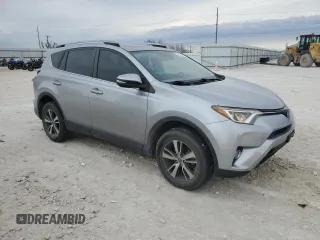 2018 Toyota RAV4 XLE with VIN JTMWFREV3JJ180152, listed as a Copart auction lot 46949465 with 103,346 mi miles and Clean Title. Bid and sale history available at DreamBid. Image 4.
