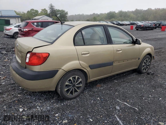 2009 Kia Rio LX with VIN KNADE223096485561, listed as a Copart auction lot 73412874 with 137,858 mi miles and Salvage Title. Bid and sale history available at DreamBid. Image 3.