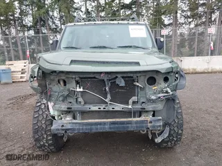 2011 Toyota FJ Cruiser with VIN JTEBU4BF5BK108168, listed as a IAAI auction lot 41829688 with 163,354 mi miles. Bid and sale history available at carsss.com. Image 13.