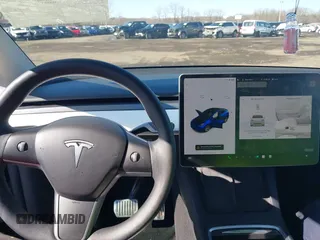 2021 Tesla Model Y Long Range with VIN 5YJYGDEE8MF293230, listed as a IAAI auction lot 41744033 with 56,797 mi miles and . Bid and sale history available at DreamBid. Image 18.