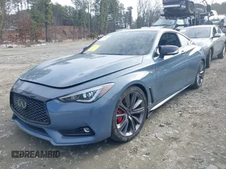 2021 Infiniti Q60 Red Sport 400 with VIN JN1FV7LKXMM530401, listed as a IAAI auction lot 41409153 with 31,247 mi miles and . Bid and sale history available at DreamBid. Image 2.