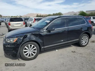 2012 Volkswagen Touareg Sport with VIN WVGFF9BP1CD000055, listed as a Copart auction lot 58552125 with 128,037 mi miles and Salvage title. Bid and sale history available at DreamBid. Image 1.