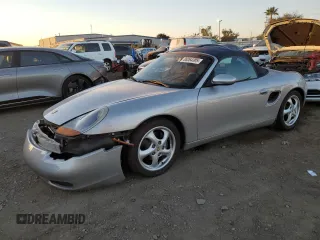 1999 Porsche Boxster z VIN WP0CA2982XU622701, wystawiony jako Copart lot #88064305 z przebiegiem 45 059 mil mil oraz Szkoda całkowita • Salvage title. Historia ofert i sprzedaży dostępna na DreamBid. Obrazek 1.