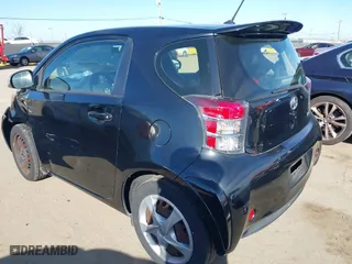 2012 Scion iQ with VIN JTNJJXB02CJ018324, listed as a IAAI auction lot 41692406 with 162,445 mi miles. Bid and sale history available at carsss.com. Image 3.