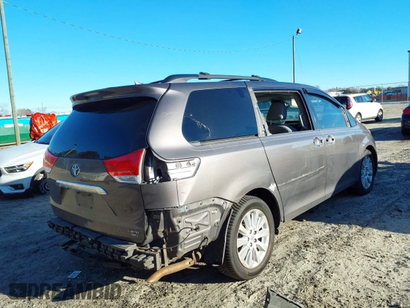2011 Toyota Sienna XLE with VIN 5TDDK3DC8BS009739, listed as a IAAI auction lot 41638710 with 235,396 mi miles. Bid and sale history available at carsss.com. Image 4.