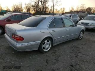 2000 Mercedes-Benz E-Class with VIN WDBJF70J7YB049473, listed as a Copart auction lot 82396624 with 197,515 mi miles and Salvage Title. Bid and sale history available at carsss.com. Image 3.