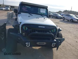 2017 Jeep Wrangler Unlimited Sport with VIN 1C4HJWDG1HL580136, listed as a IAAI auction lot 41193905 with 63,875 mi miles. Bid and sale history available at carsss.com. Image 12.