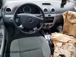 2005 Suzuki Reno S z VIN KL5JD66Z95K217050, wystawiony jako Copart lot #86785194 z przebiegiem 77 614 mil mil oraz Szkody całkowita. Historia ofert i sprzedaży dostępna na DreamBid. Obrazek 8.