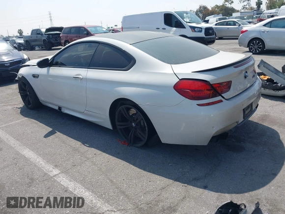 2013 BMW M6 z VIN WBSLX9C52DD159906, wystawiony jako IAAI lot #42095042 z przebiegiem 105 463 mil mil oraz . Historia ofert i sprzedaży dostępna na DreamBid. Obrazek 3.