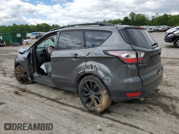 2017 Ford Escape SE z VIN 1FMCU9GD7HUB76204, wystawiony jako Copart lot #58334725 z przebiegiem Nie podano mil oraz Szkoda całkowita • Salvage title. Historia ofert i sprzedaży dostępna na DreamBid. Obrazek 2.