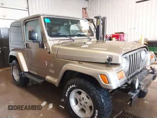 2003 Jeep Wrangler Sahara z VIN 1J4FA59S83P343234, wystawiony jako IAAI lot #41644074 z przebiegiem 197 461 mil mil oraz . Historia ofert i sprzedaży dostępna na DreamBid. Obrazek 13.