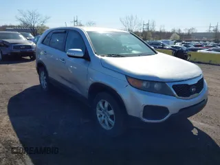 2012 Kia Sorento LX with VIN 5XYKT3A12CG290507, listed as a IAAI auction lot 42004725 with 299,075 mi miles. Bid and sale history available at carsss.com. Image 1.