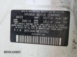 2021 Hyundai Accent SE z VIN 3KPC24A67ME147852, wystawiony jako Copart lot #56065625 z przebiegiem 77 003 mil mil oraz Szkoda całkowita • Salvage title. Historia ofert i sprzedaży dostępna na DreamBid. Obrazek 13.