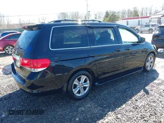 2008 Honda Odyssey Touring with VIN 5FNRL38948B029193, listed as a IAAI auction lot 41618424 with 219,964 mi miles. Bid and sale history available at carsss.com. Image 4.