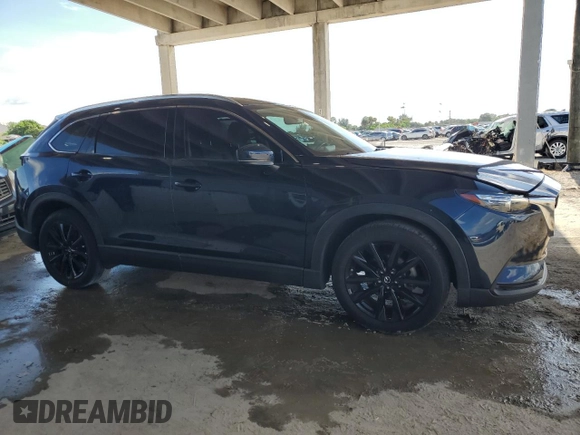 2022 Mazda CX-9 Touring Plus with VIN JM3TCBAYXN0607056, listed as a Copart auction lot 61740065 with 59,281 mi miles and Salvage title. Bid and sale history available at DreamBid. Image 4.