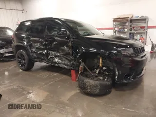 2017 Jeep Grand Cherokee SRT with VIN 1C4RJFDJ9HC739324, listed as a IAAI auction lot 40898998 with 92,547 mi miles. Bid and sale history available at carsss.com. Image 1.