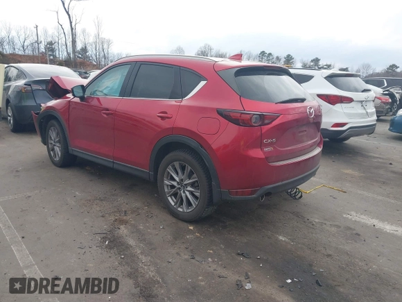 2020 Mazda CX-5 Grand Touring with VIN JM3KFADMXL0842026, listed as a IAAI auction lot 41477339 with 60,755 mi miles. Bid and sale history available at carsss.com. Image 3.