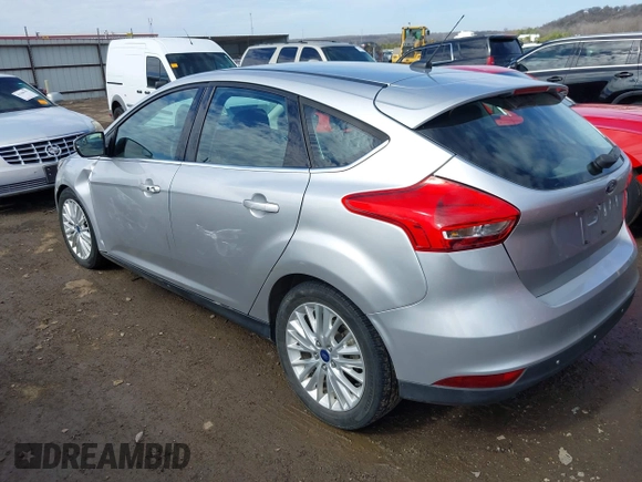 2017 Ford Focus Titanium with VIN 1FADP3N26HL309903, listed as a IAAI auction lot 41642306 with 107,762 mi miles and . Bid and sale history available at carsss.com. Image 3.