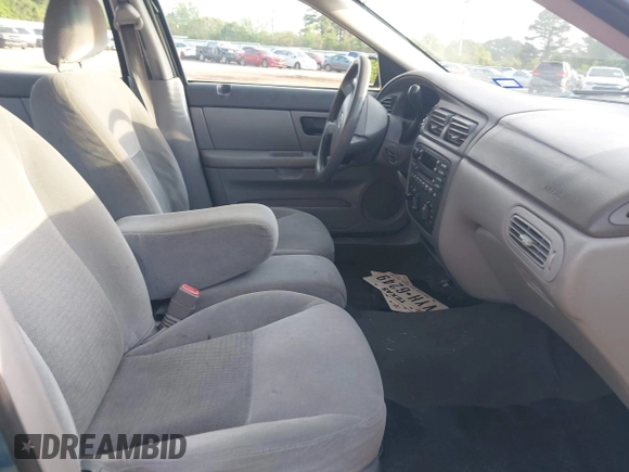 2006 Ford Taurus SE with VIN 1FAFP53U26A179541, listed as a IAAI auction lot 42000612 with 214,881 mi miles. Bid and sale history available at carsss.com. Image 5.