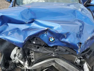 2017 BMW X1 xDrive28i with VIN WBXHT3C32H5F81460, listed as a Copart auction lot 55998515 with 123,853 mi miles and Salvage title. Bid and sale history available at DreamBid. Image 11.
