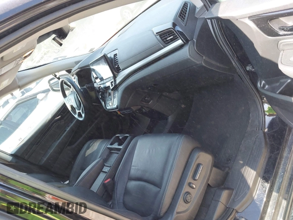 2021 Honda Odyssey Touring with VIN 5FNRL6H84MB027396, listed as a IAAI auction lot 42616650 with 67,207 mi miles and . Bid and sale history available at DreamBid. Image 5.
